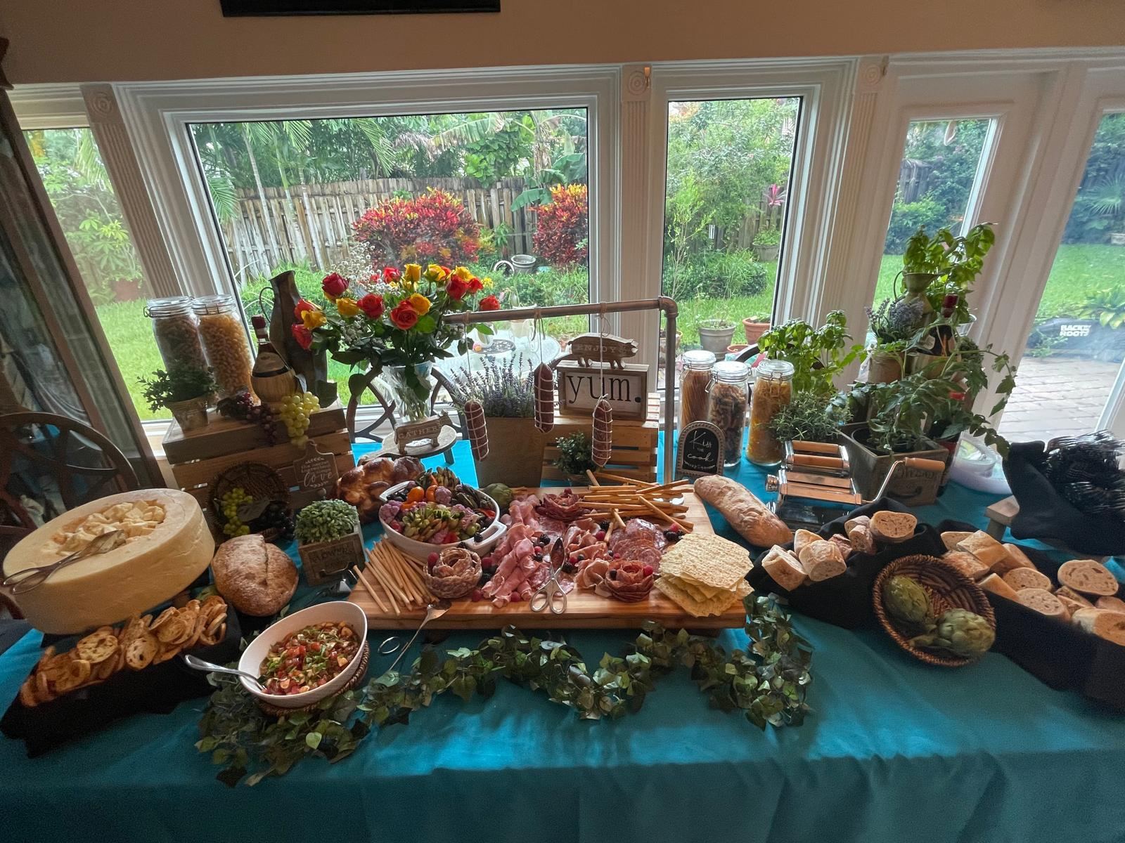 Charcuterie and antipasto grazing table with breads and cheeses